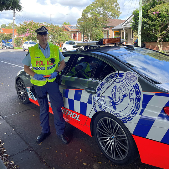 Highway patrol officer and vehicle in Leichhardt